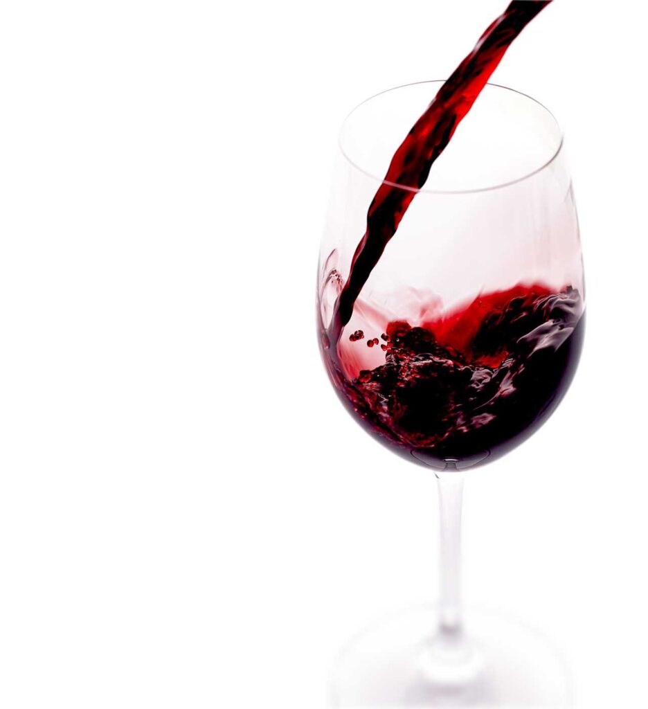 Red wine pouring into a glass